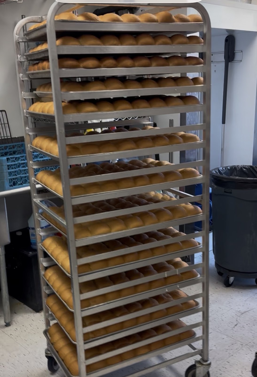 Racks of dinner rolls baked before the doors open at The Donut Run