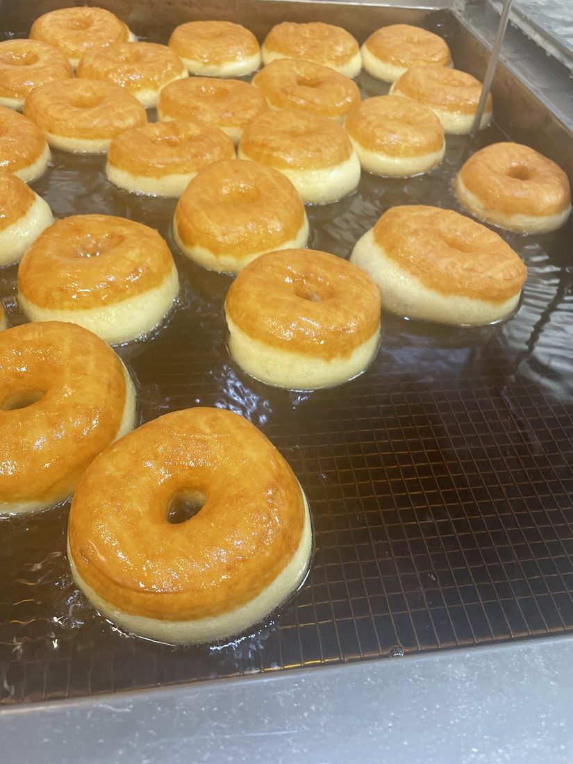 Donuts in the fryer at The Donut Run in Utah